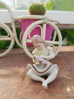 Porcelain baby girl figurine