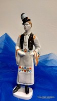 Hand-painted porcelain lad from Hollóháza, dressed in meep costume.