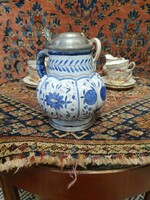 A faience jug marked with a 3-pronged crown coat of arms. 18 cm high. In very nice condition. Is it the end of 19.Sz?