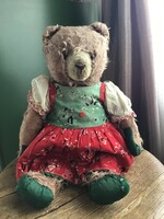Antique teddy bear stuffed with mohair straw, very used