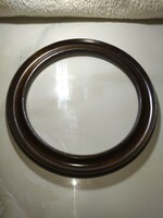 Beautiful old round wooden picture frame with a diameter of 32 cm
