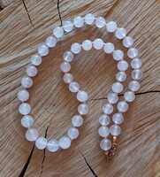 Rose quartz necklace with knotted lacing