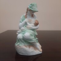 Motherhood in Herend, porcelain figure of a nursing mother with her child