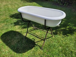 Old vintage enameled lampart in baby bath with enamel bathtub for kids tub with bathtub stand