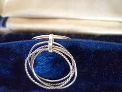 A silver ring consisting of several rings _marked