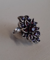 Old silver-plated ring in beautiful condition set with purple polished stones in a patterned setting