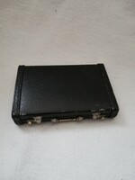Vintage calculator in a suitcase