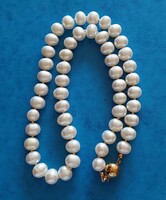 Real pearl necklace with 14k gold ball clasp, knotted string