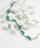 Silver bracelet with turquoise stone.