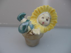 Sunflower porcelain figurine with baby face