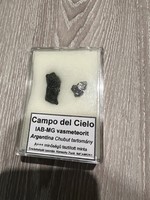 1 campo del cielo iron meteorite and a moldavite in one.