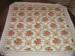 A charming baroque rose pattern tablecloth with a lace edge