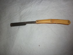 Antique handle razor with carved handle