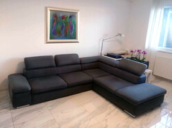 Comfortable, bluish-gray corner sofa