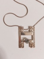 Special square pendant with pale blue stone