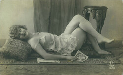1909. Erotic photo of a young woman. Original paper image. Old photo. Black and white photo sheet, postcard.