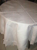 Wonderful rosy handmade crocheted snow-white damask tablecloth