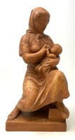 Terracotta statue of a mother with her child