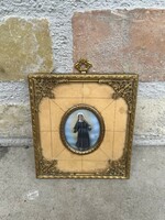 Miniature painted on bone, in a gilded filigree frame