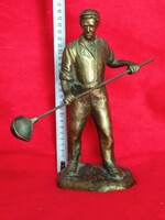 Metal casting worker bronze statue