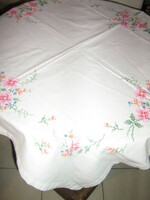 Beautiful vintage colorful floral hand embroidered cross on white tablecloth