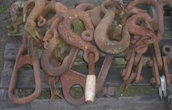 Old heavy crane hooks of various strengths for lifting ships, etc., etc