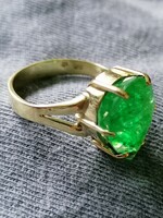 Gold ring with emerald stone
