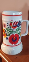 A beautiful mug of Hóllóház porcelain with a Hungarian folk motif