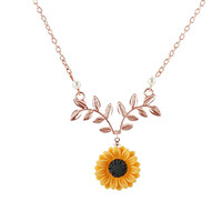 Nym42 - sunflower flower pendant on a rosegold colored necklace