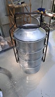 Old retro 4-part aluminum food barrel with food