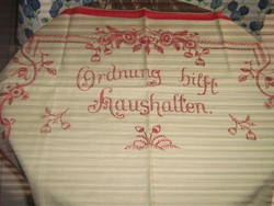 Beautiful hand-embroidered wall hanging with red floral German lettering