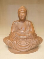 Meditating ceramic buddha