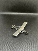 Silver miniature airplane