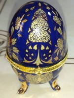 Beautiful flower-patterned cobalt blue porcelain jewelry box in the shape of an egg