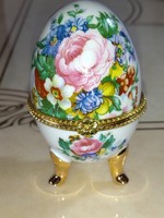 A beautiful flower-patterned porcelain jewelry box in the shape of an egg
