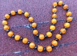 Amber - string necklace with black pearls - impressive piece