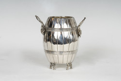 Silver barrel-shaped offering