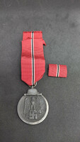 Eastern front pendant (unmarked) with single ribbon band