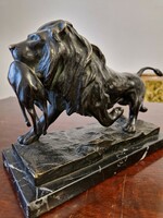 Bronze lion on a marble base