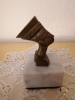 Solid, copper nofrette head, on a marble base