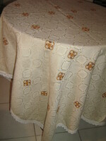 Beautiful elegant hand-embroidered woven tablecloth with lacy edging
