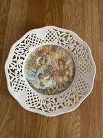 A dreamy porcelain decorative plate with an openwork edge /mother with her children/
