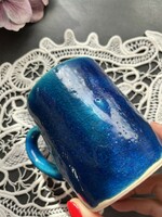 A wonderful rustic, modern ceramic mug with a blue glaze
