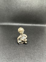 Silver miniature potty child figure