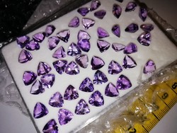 Faceted amethyst gemstones, triangle