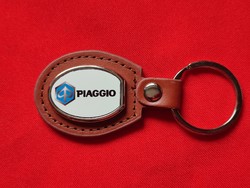 Piaggo metal key ring on a leather base