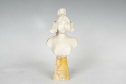 Alabaster bust of a woman on a marble plinth