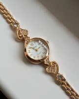 Gold-plated rhinestone quartz women's wristwatch.