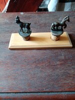 2 antique plugs, on a wooden board
