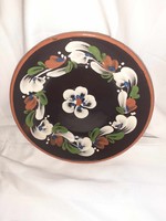 Ceramic wall plate with a folk motif